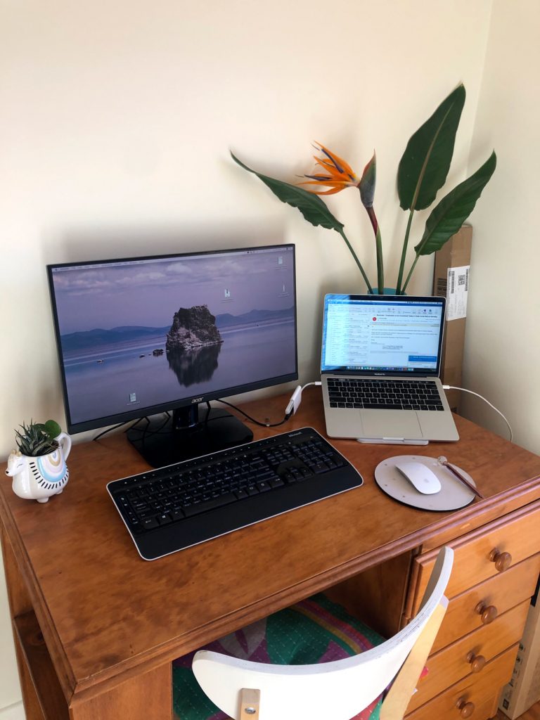 image of laptop on desk to illustrate example of working from home in 2020